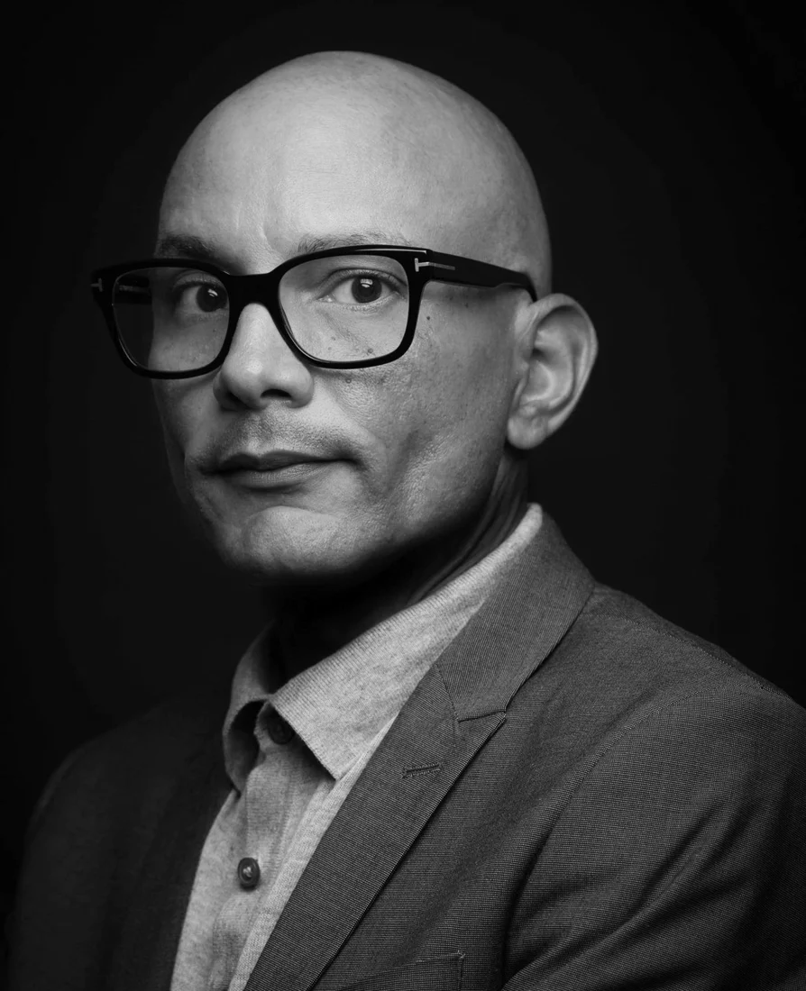 Carlos Javier Sanchez, founder and chief creative officer of pixelreflex MEDIA, in a black and white portrait.
