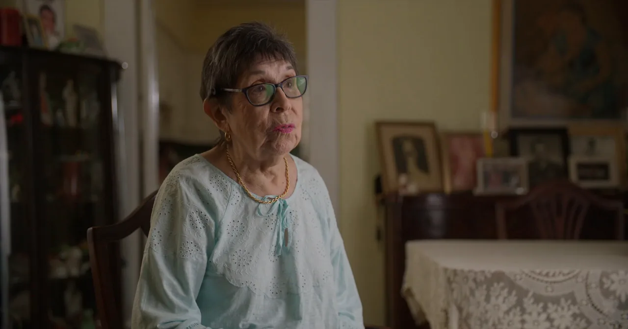 Ms. Herrera talks about her home in her dining room, surrounded by family photos.