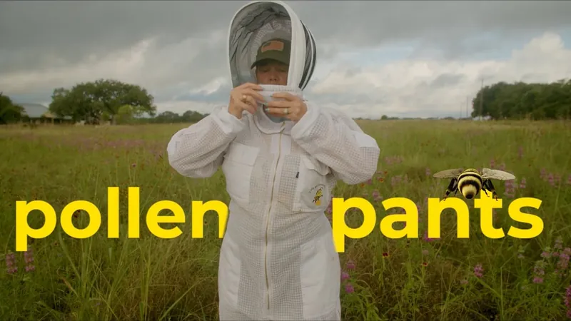 Beekeeper Tamara Carroll pulls on her veil in a wildflower field next to the Pollen Pants title.