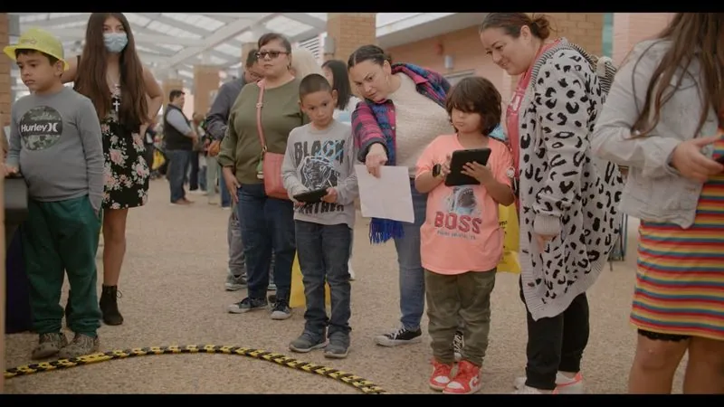 Children and parents gather at a hands-on exhibit during SEE Your Future Career Day, a free STEM event.