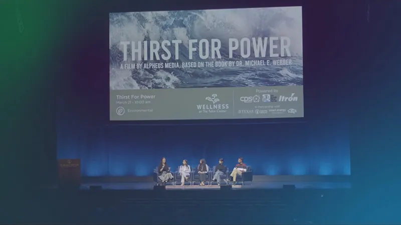 A panel sits on stage beneath a Thirst for Power screen at a World Water Day screening in San Antonio.